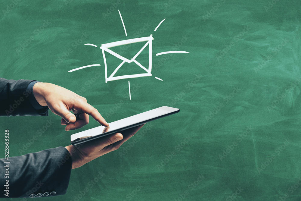 Aufkleber hand using tablet with drawing e-mail symbol