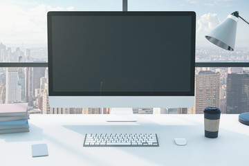 Minimalistic office with computer on table