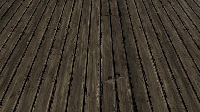 An aerial view over old rustic timber floorboards - seamless looping.