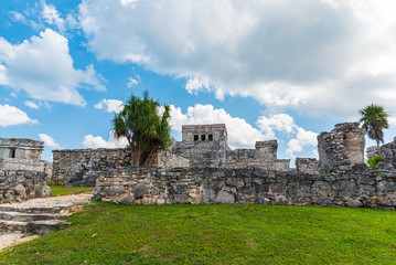 Tourists visi Mayan ruins in Tulum, Mexico