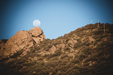 moon in a rock of a mountain
