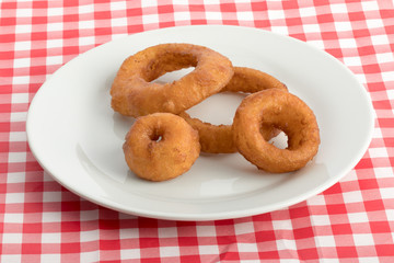 jumbo onion rings on aplate isolated on white