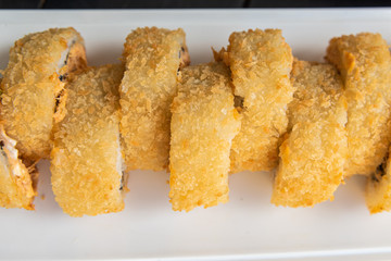 Sushi on the plate on the black table