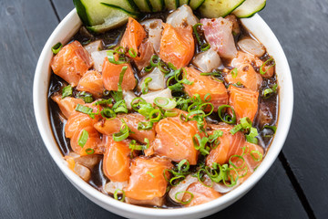 Ceviche in the bowl on the black table