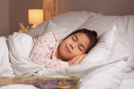 Cute Little Asian Girl Sleeping In Bed