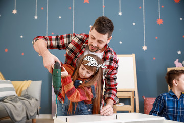 Family assembling furniture at home