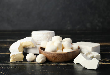 Different dairy products on dark background