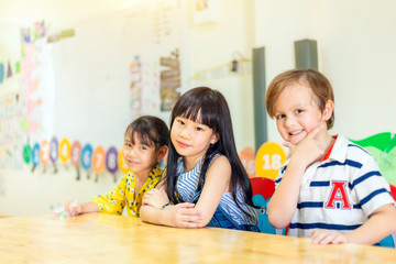 Group of Happy children in a class of preschool. international School.
