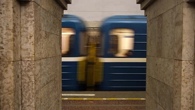 Close-up of blue underground train departs from the Krestovsky Island station. Concept. Russian subway underground station vestibule.