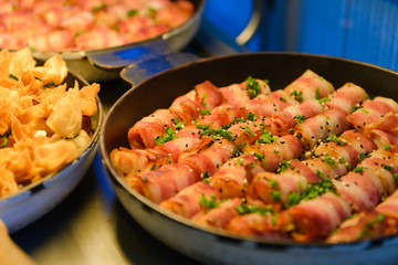 Prawn wrapped with bacon and rosemary. baked appetizer. Close-up shot.