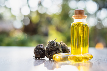 CBD hemp oil. Medicines extracted from CBD oil. Placed on the table. Natural background....