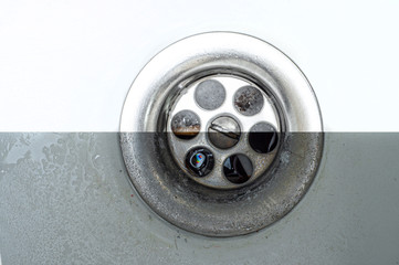 Photos before and after washing the drain hole with effective chemical detergents. Cleaning service advertisement.