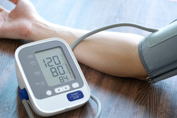 Man check blood pressure monitor and heart rate monitor with digital pressure gauge. Health care...
