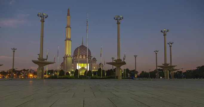 Sunrise time lapse at Putrajaya square, Putrajaya, Malaysia. The Putra Mosque or Masjid Putra, principal mosque of Putrajaya Wilaya. Early morning sunrise at the Putra Square. Morning sun 