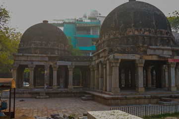 A mesmerizing view of hauz khas lake and garden from the hauz khas fort at hauz khas village at winter foggy morning.