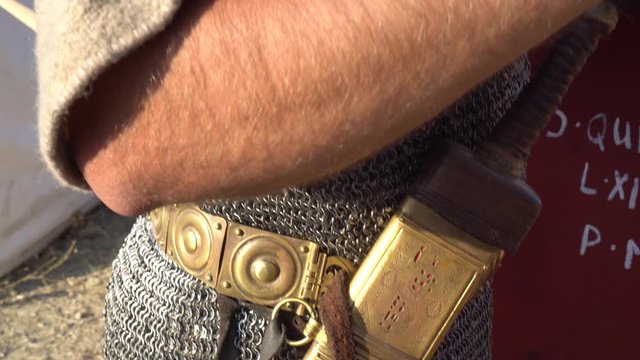 Roman legionary soldier uniform. Armour, tunic, helmet, greaves, sandals, mail, lorica, balteus, weapons, shield and sword