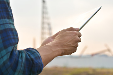 Close up Engineer Construction holding tablet checking work estate technology