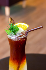 Cold brew coffee with orange juice at cafe.