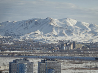 Fototapeta na wymiar View of the city of Ust-Kamenogorsk (KAZAKhstan). Winter landscape. Aerial. Cityscape. High mountain