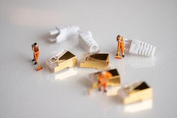Miniature People: Worker cleaning professional repairman holding a cleaning brush inside old personal computer.cleaning and maintenance concept, close up view.