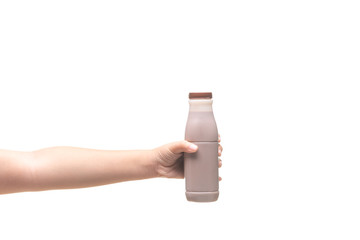 Kid Hand holding Bottle of fresh milk chocolate isolated on white background.