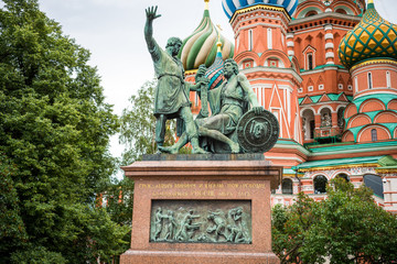 Fototapeta na wymiar Monument to Minin and Pozharsky, a bronze statue on Red Square in Moscow, Russia, in front of Cathedral of Vasily the Blessed, or Saint Basil's Cathedral, regarded as a symbol of the country.