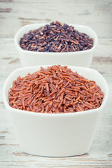 Vintage photo, Black and red rice in bowls, healthy gluten free food concept