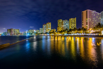 Fototapeta na wymiar Fantastic view of tropical city at night in Honolulu, Hawaii, USA