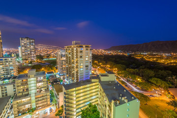 Night view nature and cityscape concept: evening outdoor urban view of modern real estate city in Honoluu, Hawaii.