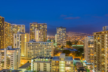 Fototapeta na wymiar Night view nature and cityscape concept: evening outdoor urban view of modern real estate city in Honoluu, Hawaii.