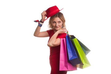 blonde girl in a red dress with Shopping Bags. Sales