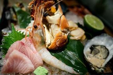Obraz na płótnie Canvas Raw delicious seafood sashimi set crop.