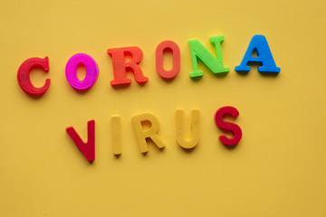 Cornona virus spelled out against yellow background