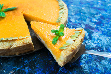  A traditional Thanksgiving pumpkin pie homemade. Close-up.