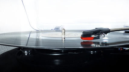 Fototapeta na wymiar Vinyl turntable on a white background. Retro audio equipment for vinyl disk.