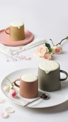 Three cup of milk tea with flowers.