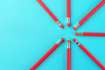 Fototapeta premium pencils lie on a colored background in a circle
