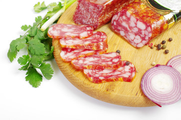 Meat products, spices, onions and herbs on the kitchen table