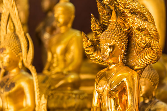 Beautiful golden yellow Buddha statue in the temple.
