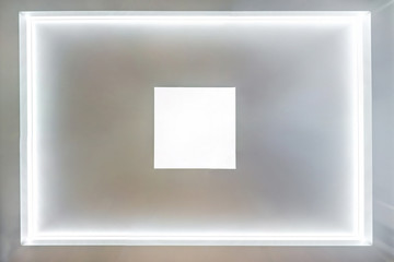 look up on suspended ceiling with halogen spots lamps and drywall construction in empty room in...