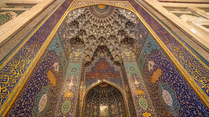 Fototapeta na wymiar Mihrab in Sultan Qaboos Grand Mosque Interior Hall in Oman