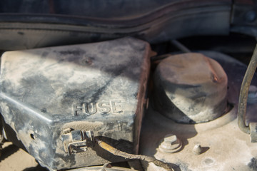 close up of an automobile fuse box in the engine compartment