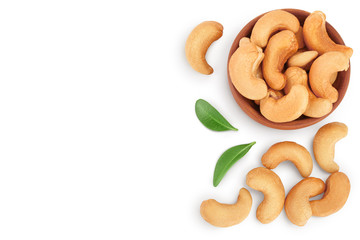 Roasted Cashew nuts in bowl isolated on white background with clipping path and full depth of field. Top view with copy space for your text. Flat lay