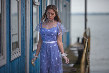 beautiful girl in a vintage dress of the 19th century