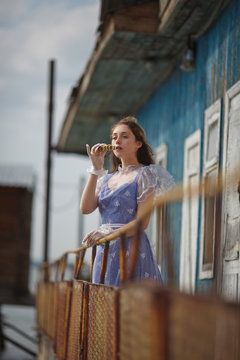 beautiful girl in a vintage dress of the 19th century