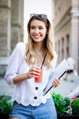 Beautiful young happy cheerful woman enjoying her time and freedom