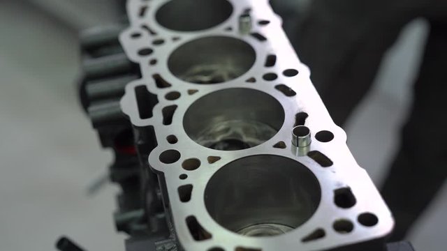 Engine service part spare car crankcase at service station repair tools internal vehicle motor camera movement