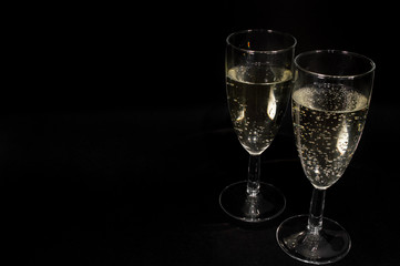 Champagne glass on black background