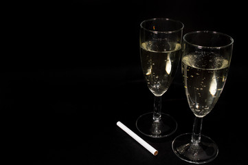 Champagne glass on black background
