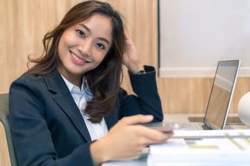 Fototapeta na wymiar Portrait of business asian woman using smartphone at office, concept business asian woman working in office and shopping online